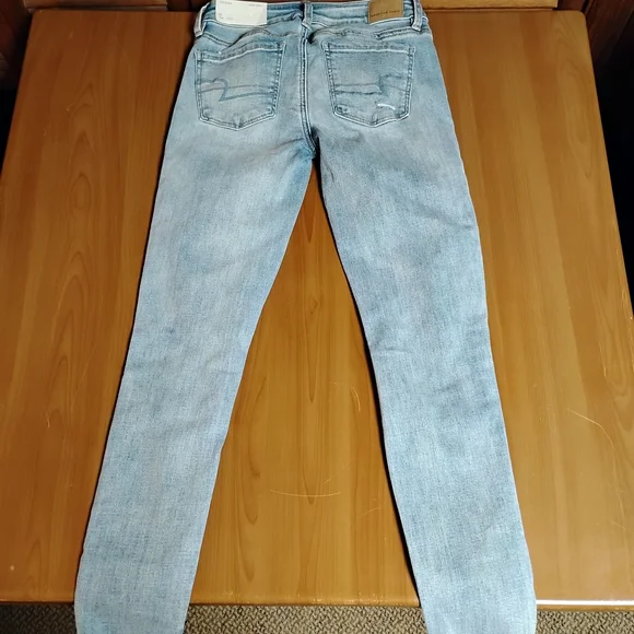 American Eagle Light Blue Ripped Jegging Super Stretch Jeans Size 0 25w - Picture 2 of 9